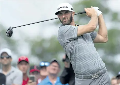  ?? FRANK GUNN/THE CANADIAN PRESS ?? Dustin Johnson watches his tee shot on the 18th hole during the second round of the Canadian Open On Friday at Glen Abbey in Oakville, Ont.