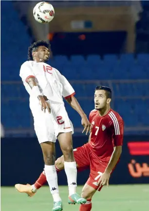  ?? AFP file ?? Oman’s Ahmed Kano (left) and UAE’s Ali Mabkhout fight for the ball during their Gulf Cup of Nations 2014 match in Riyadh. Mabkhout emerged the top scorer of the tournament with five goals. —