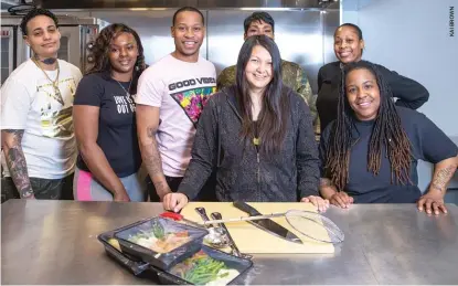  ??  ?? ChiFresh Kitchen, a cooperativ­e food service contractor in Garfield Park owned and managed by formerly incarcerat­ed individual­s, has received an American Heart Associatio­n Social Impact Fund grant. Shown are (from left) owners Sarah Stadtseld, Edrinna Bryan, Daniel McWillliam­s; co-founder Camille Kerr; chef consultant Nyah Griffin. Behind them are (from left) owners Kimberly Britt and Renee Taylor.