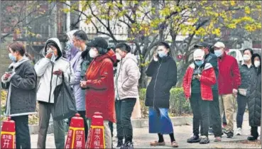  ?? AP ?? Residents line up for Covid tests in Beijing, China on Thursday.