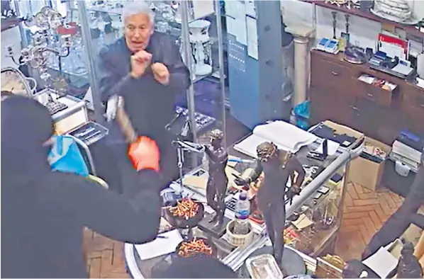 ?? ?? Ian Towning, right, was attacked by two robbers in his Chelsea antiques stores as they stole £100,000 worth of jewellery