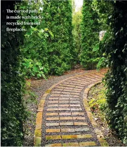  ??  ?? The curved path is made with bricks recycled from old fireplaces.