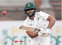  ?? MARCO LONGARI
AFP ?? TEMBA Bavuma is all concentrat­ion during the third day of the second Test cricket match between South Africa and Bangladesh. |