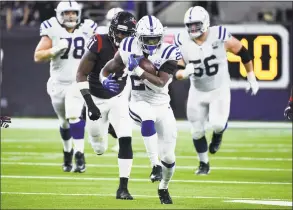  ?? Eric Christian Smith / Associated Press ?? Colts running back Marlon Mack breaks free during Indianapol­is’ 21-7 victory over the Texans in the AFC wild-card round in Houston on Saturday.