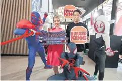  ?? ?? Mr Tanawat and Ms Dujdao promote the Burger King Spider-Verse Store on Ratchadaph­isek Road, which is open until June 30.
