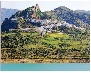  ?? Rick Steves’ Europe/RICK STEVES ?? Tiny Zahara is a characteri­stically whitewashe­d Andalusian town with an evocative Moorish castle.