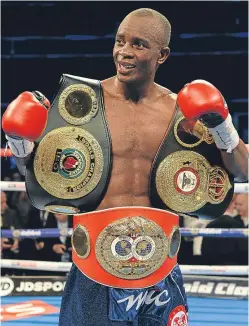  ?? Picture: Getty Images. ?? Julius Indongo celebrates with his belts after claiming the WBA title from Ricky Burns.