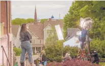  ?? MARK MIRKO ?? A film crew sets up to shoot a scene in the yard of a Hartford residence on Charter Oak Avenue in Hartford in May, where “Call Jane” was being filmed.