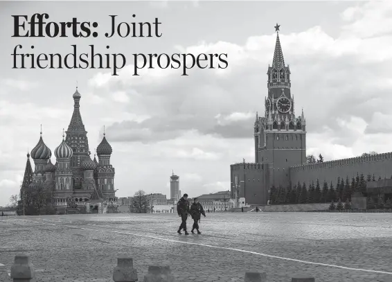  ?? ALEXANDER ZEMLIANICH­ENKO / AP ?? Police officers patrol Red Square in Moscow last month, with St. Basil’s Cathedral, left, and the Spasskaya Tower, right, in the background.