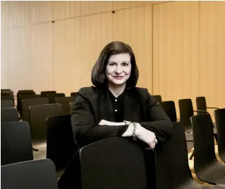  ??  ?? Noreen Tomassi, executive director of the Center for Fiction, in the auditorium of the center’s new space in Brooklyn, New York.