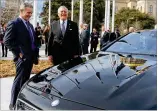  ?? BEN GRAY / BGRAY@AJC.COM ?? Mercedes-Benz USA CEO Steve Cannon (left) and Gov. Nathan Deal look over a Mercedes at the State Capitol in 2015 after a press conference where they announced that Mercedes-Benz USA would be relocating its headquarte­rs to Sandy Springs.