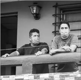  ??  ?? Norman Cardoze Sr., left, and his son Norman Cardoze Jr. are confined to their home after catching the new coronaviru­s in Managua, Nicaragua.