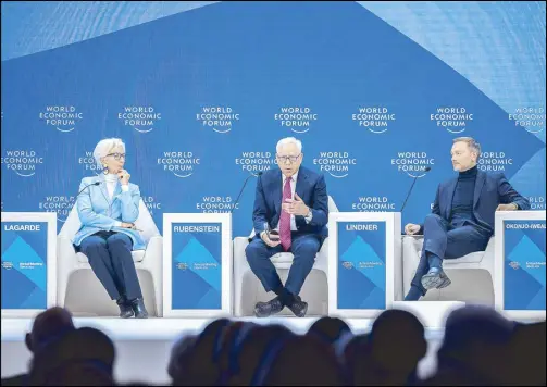  ?? AFP ?? (From left) president of the European Central Bank Christine Lagarde, co-chairman of the private equity firm of The Carlyle Group David Rubenstein and German Finance Minister Christian Lindner attend a session on the closing day of the World Economic Forum (WEF) annual meeting in Davos on Jan. 19.