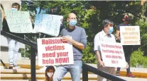  ?? DARREN MAKOWICHUK ?? Led by the Hailstorm Action Committee, a group of residents from northeast Calgary who were affected by the June 13 hailstorm rally outside the Mcdougall Centre Tuesday.