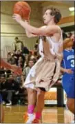  ?? Photo by Mike Bucher ?? Pennsbury’s Steve Ciotti gets off a pass through traffic in Falcons stunning win over Bensalem.