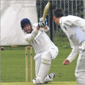  ?? Picture: Chris Davey FM4366637 ?? Ben Purcell opening for Whitstable hammers the ball back past Sandwich bowler Ashleigh Cox during the Kent League match