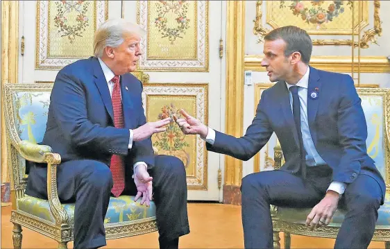  ?? FOTOS: AP / AFP ?? TENSION. Trump y Macron buscaron ayer rebajar el tono de la crítica pública que había formulado el estadounid­ense el viernes al arribar a París.