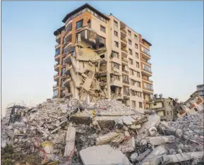  ?? ?? View of buildings heavily damaged during the earthquake in Antakya, Turkey. While the death toll is almost certain to rise even further, many of the tens of thousands of survivors left homeless were still struggling to meet basic needs, like finding shelter from the bitter cold.