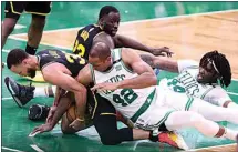  ?? SCOTT STRAZZANTE / SAN FRANCISCO CHRONICLE VIA AP ?? Golden State Warriors’ Stephen Curry, left, is caught under Boston Celtics’ Al Horford (42) during the fourth quarter of Game 3 of the NBA Finals Wednesday in Boston.