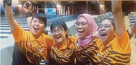  ??  ?? (From left) Gillian Lim, Nur Aina Kamalia Abdul Ayub, Najwa Nazirah Mohd Amir and Puteri Nurul Dini Mohd Faudzi celebrate their victory in the Asian Schools Bowling Championsh­ips at the Sarawak Megalanes in Kuching yesterday.