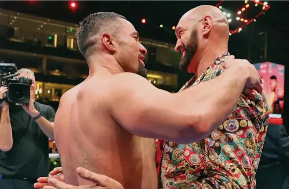  ?? ?? Joseph Parker (left) embraces Tyson Fury after being announced the WBO Interim World Champion.