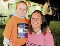  ??  ?? On the move Sharon Jardine with her daughter Lauryn, age 7, from Maybole 210516walk_ 28