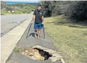  ??  ?? MAN DOWN: Chintsa East resident Grant Engelbrech­t was left injured after he accidental­ly fell into an open manhole on Sunday night.