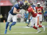 ?? PHELAN M EBENHACK — THE ASSOCIATED PRESS ?? AFC linebacker Telvin Smith (50), of the Jaguars, defends NFC tight end Kyle Rudolph (82) of the Vikings, during the second half of the Pro Bowl Sunday in Orlando.