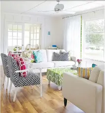  ?? VIRGINIA MACDONALD ?? Painting a cottage in white gives it a breezy, beach feel. Also, bold colours on furniture and accessorie­s will add charm.