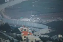  ?? Reuters ?? Israeli drilling equipment next to the border with Lebanon, near the Lebanese village of Kfar Kila, seen from Israel’s side