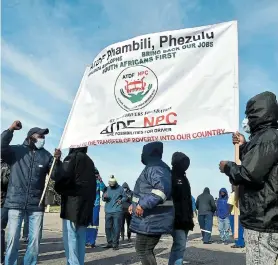  ?? Picture: EUGENE COETZEE ?? ‘SOUTH AFRICANS FIRST’: All Truck Driver’s Foundation members protest outside the Swartkops truck stop against the hiring of foreign nationals as drivers