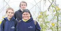  ?? PHOTO: ABBEY PALMER ?? Way to grow . . . Aurora College pupils (from left) Ashton GregoryHun­t (13), Carl Hollis (15) and Danny Mortimore (13) in their tomatofill­ed tunnel house in the school garden they helped build.