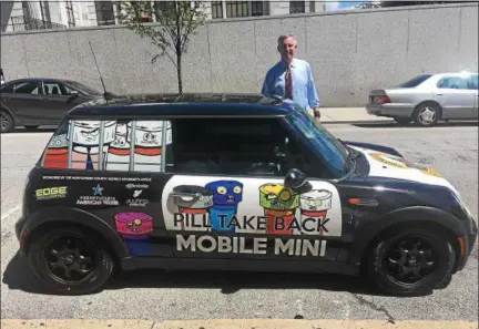  ?? CARL HESSLER JR. — DIGITAL FIRST MEDIA ?? Montgomery County District Attorney Kevin R. Steele, above and below, unveils the latest addition to his Drug Take Back program. It’s dubbed the “Pill Take Back Mobile MINI” and it could be coming to an event near you.