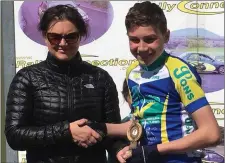  ??  ?? Ciaran Connor (Drogheda Wheelers) receives his prize for fourth place in Dungarvan on Sunday.