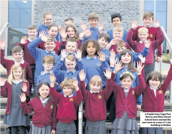  ??  ?? > Pupils from Ysgol Pen Barras and Rhos Street School have started the new term in a new £11.2m building in Ruthin