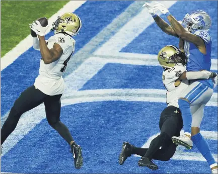  ?? CARLOS OSORIO — THE ASSOCIATED PRESS ?? New Orleans Saints’ safety Marcus Williams intercepts a pass intended for Detroit Lions receiver Kenny Golladay in Sunday’s loss.