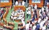  ??  ?? Opposition leaders stage a protest in Lok Sabha during the monsoon session of Parliament on Wednesday.