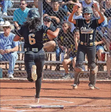  ?? YUMA SUN ARCHIVES ?? CIBOLA’S ELA HENRY (3) SIGNALS FOR TEAMMATE CHRISTINA ROBLES to score standing up during a May 2, 2017, game against Gilbert-Perry at Cibola. Henry, now a senior, and Robles, now a sophomore, are two of seven returning starters for the Raiders this...