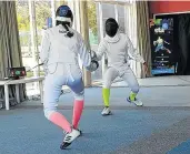  ?? Picture: SUPPLIED ?? ON GUARD: Paola Signorile, left, and Rhys Poovan in action during a fencing clinic at the Beacon Bay Country Club.