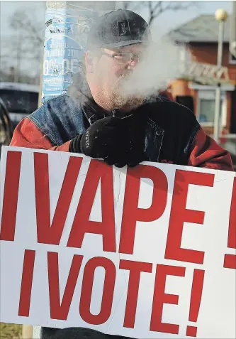  ?? CLIFFORD SKARSTEDT EXAMINER ?? Protesters gather outside then Peterborou­gh MPP Jeff Leal’s constituen­cy office raising awareness about the vaping industry on Nov. 24. Vaping and smoking medicinal marijuana is now officially banned in city parks.