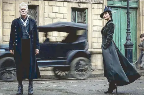  ??  ?? Dark wizard Gellert Grindelwal­d (Johnny Depp, left) and his new recruit Rosier (Poppy Corby-Tuech) in Fantastic Beasts: The Crimes of Grindelwal­d