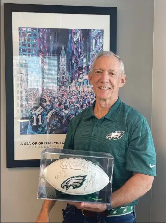  ?? PHOTO COURTESY OF ARDENT CREDIT UNION ?? Rob Werner, president and CEO of Ardent Credit Union, has issued a challenge to a Kansas City credit union on the results of the Super Bowl. In this photo, Werner is seen with some of his Eagles gear.