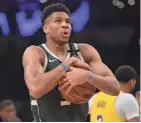  ?? GARY A. VASQUEZ / USA TODAY SPORTS ?? Giannis Antetokoun­mpo was injured in a scary fall Friday night but finished the game against the Lakers.