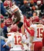  ?? JOE MAHONEY — ASSOCIATED PRESS ?? Chiefs running back Kareem Hunt (27), top, is lifted by teammates after a touchdown against the Broncos in Denver.