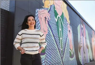  ?? (Arkansas Democrat-Gazette/Staci Vandagriff) ?? Lisa Krannichfe­ld stands in front of her mural near the intersecti­on of 6th and Chester streets in Little Rock.