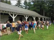  ?? PAUL POST — PPOST@DIGITALFIR­STMEDIA.COM ?? About 100 people tour Sheik Mohammed’s Greentree Stable in Saratoga Springs on Tuesday, in a program co-organized by the National Museum of Racing and Hall of Fame.