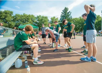  ?? BOB YURKO/SPECIAL TO THE MORNING CALL ?? The Allentown Central Catholic boys basketball team fought through the heat and a long day Sunday at Cedar Beach to claim the championsh­ip in the Cedar Beach Basketball Showcase.