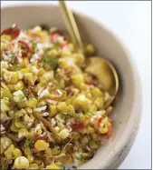  ?? MILK STREET VIA AP ?? This image released by Milk Street shows a recipe for charred corn with coconut, chilies and lime.