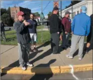  ??  ?? Watervliet Mayor Michael Manning greets runners before the Arsenal City Run 5K race on Sunday.