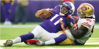  ?? ABBIE PARR/AP ?? Vikings quarterbac­k Kellen Mond is sacked by 49ers defensive tackle Kevin Givens on Saturday.